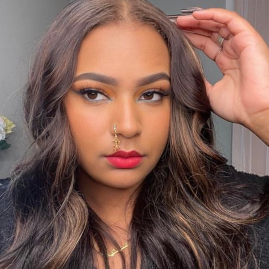Gold nose ring on brown skin discount